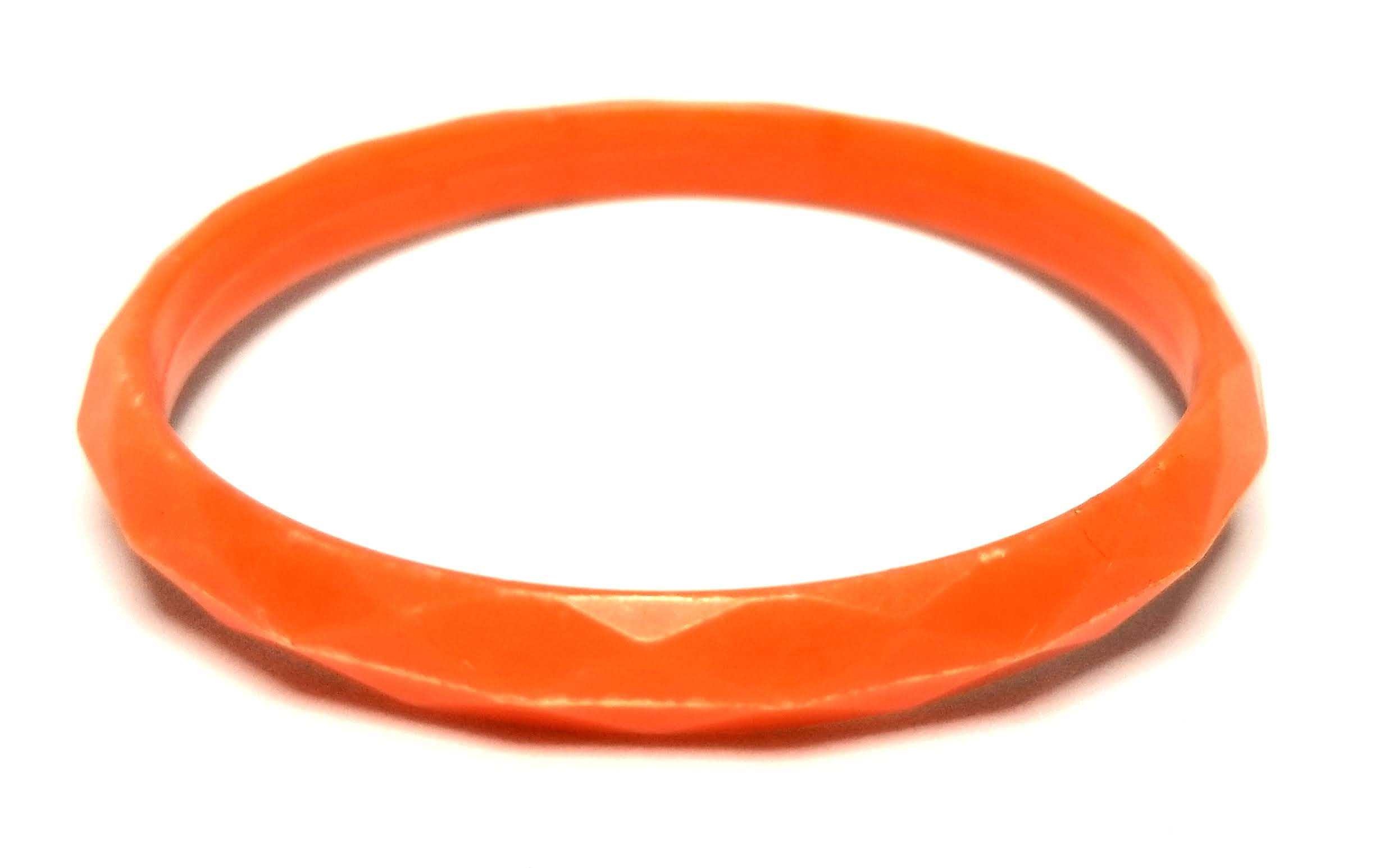 Designer by provenance, bracelet, bangle, orange colored Lucite.