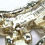 Thumbnail: Designer by Coro, brooch, wreath motif, multicolored rhinestones, gold tone.