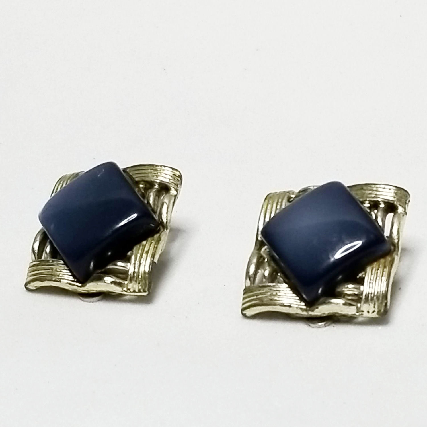 Designer by Karu, earrings, clip on blue silver tone pot metal.