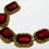 Thumbnail: Designer by Judy Lee, bracelet, red glass cabochons in gold tone pot metal.