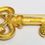Thumbnail: Designer by M Jent, brooch, key motif, with pearl in gold tone pot metal.