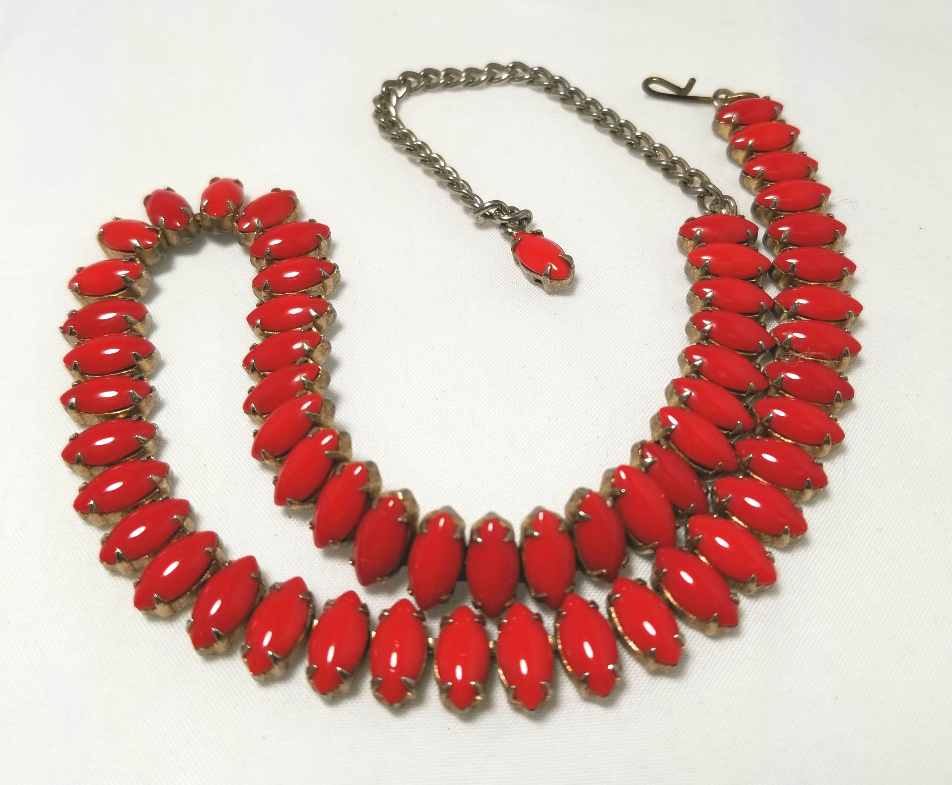 Designer by provenance. Red and gold tone pot metal princess length necklace.