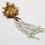 Thumbnail: Designer by Giovanni, pendant, white enamel and gold tone flower motif.