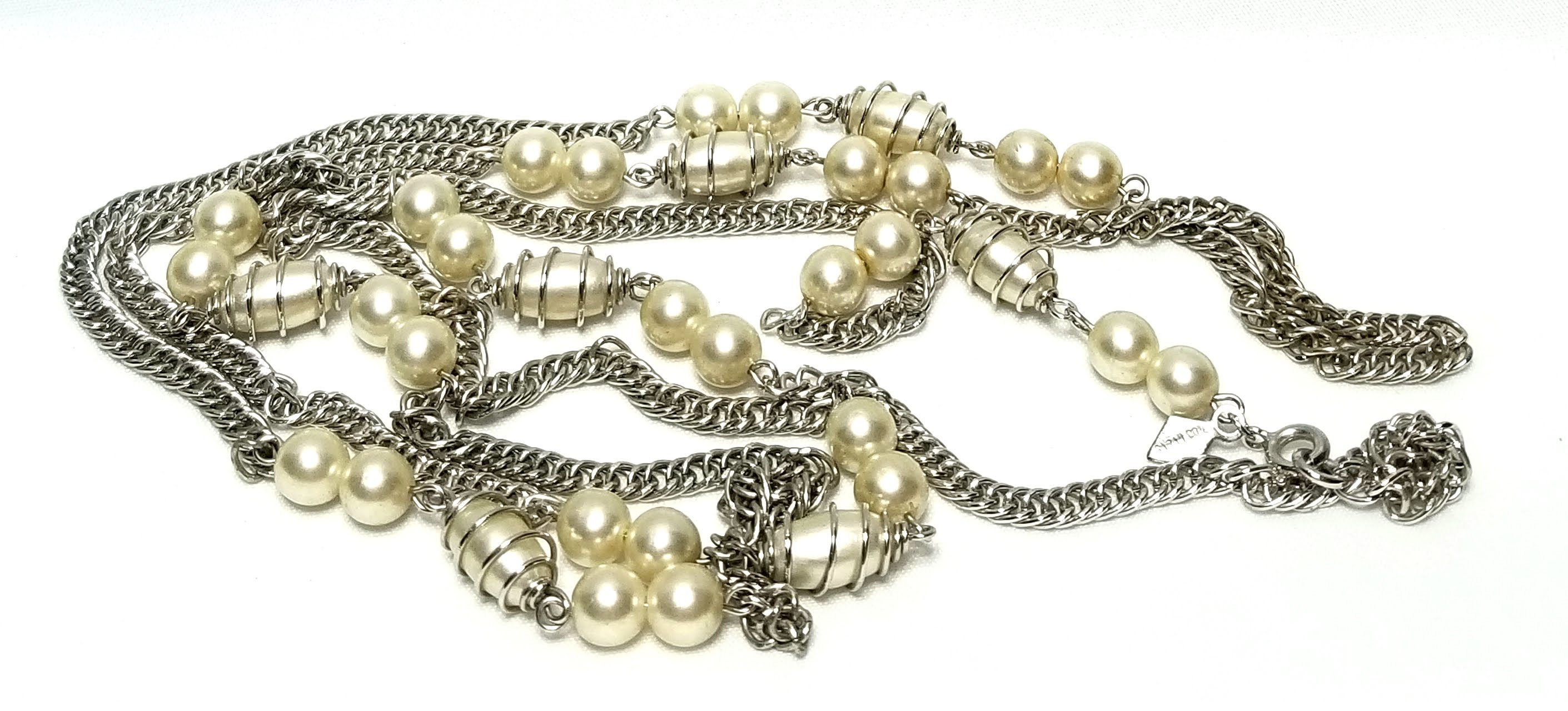 Designer by Sarah Cov, necklace, 50 inch white faux pearls in silver tone.