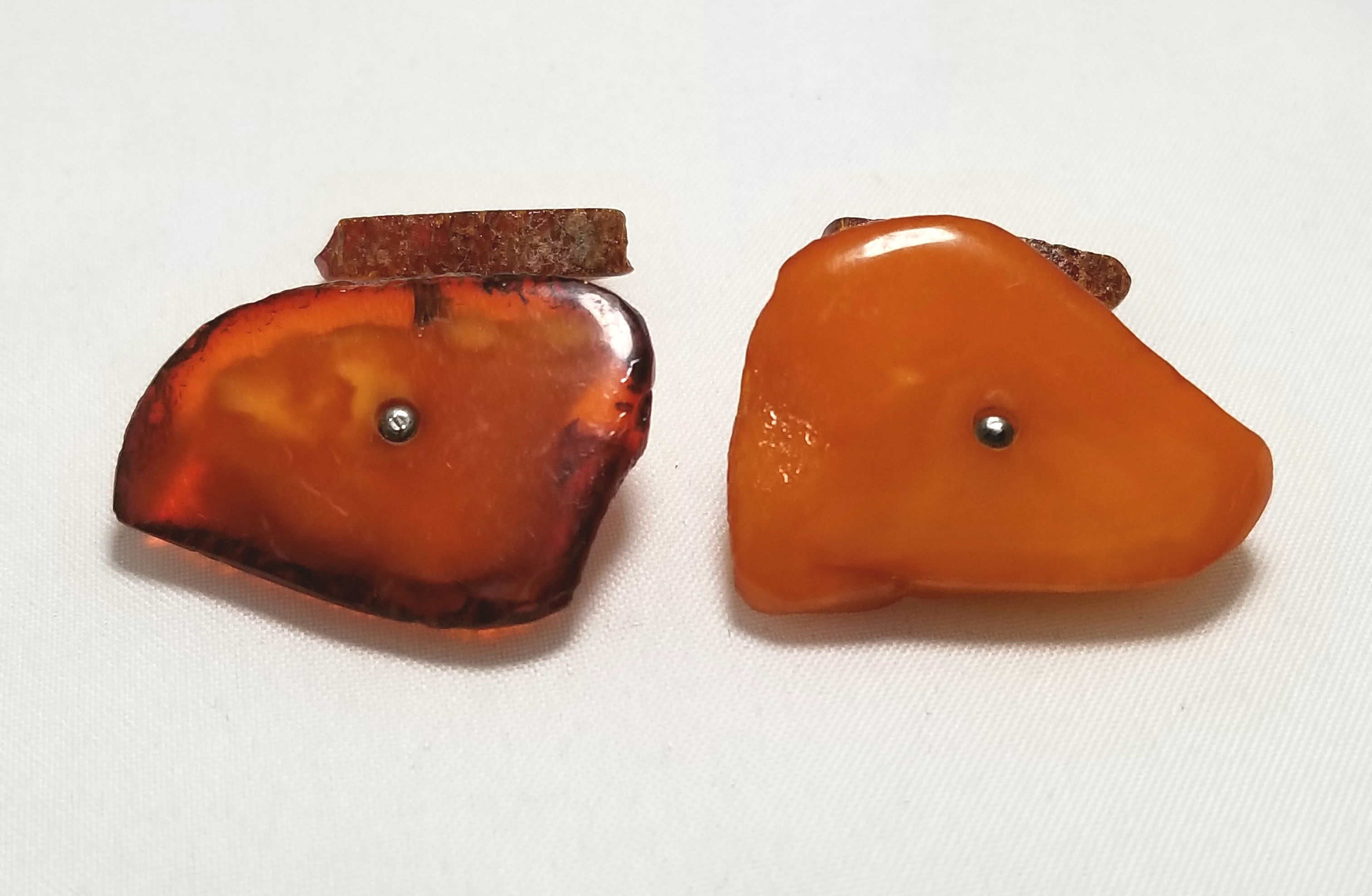 Designer by provenance cuff-links, amber, free form with silver tone chain.