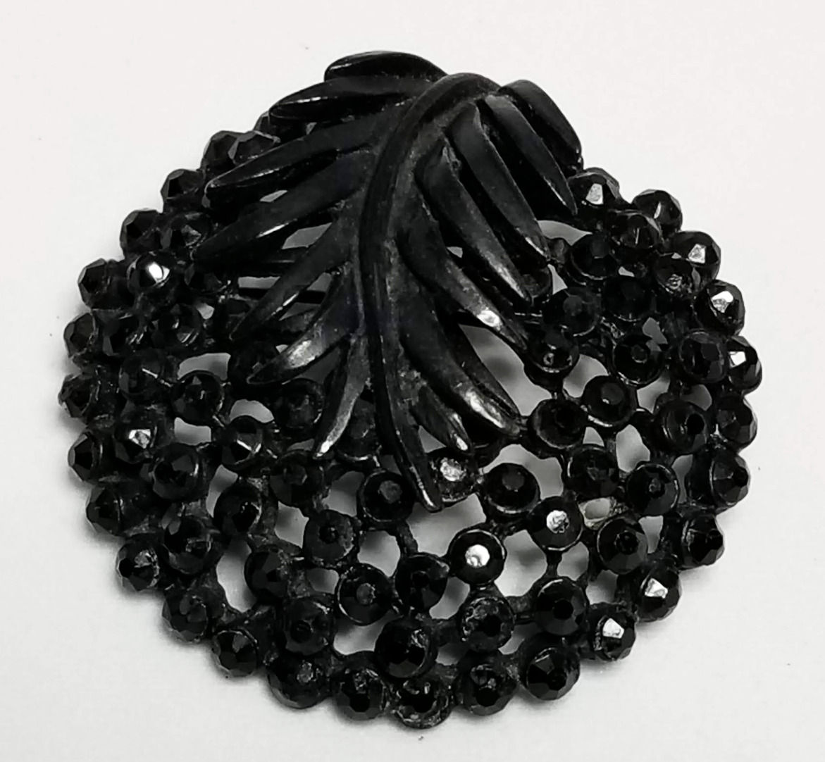 Designer by Karu, brooch, black round, in silver stone pot metal.