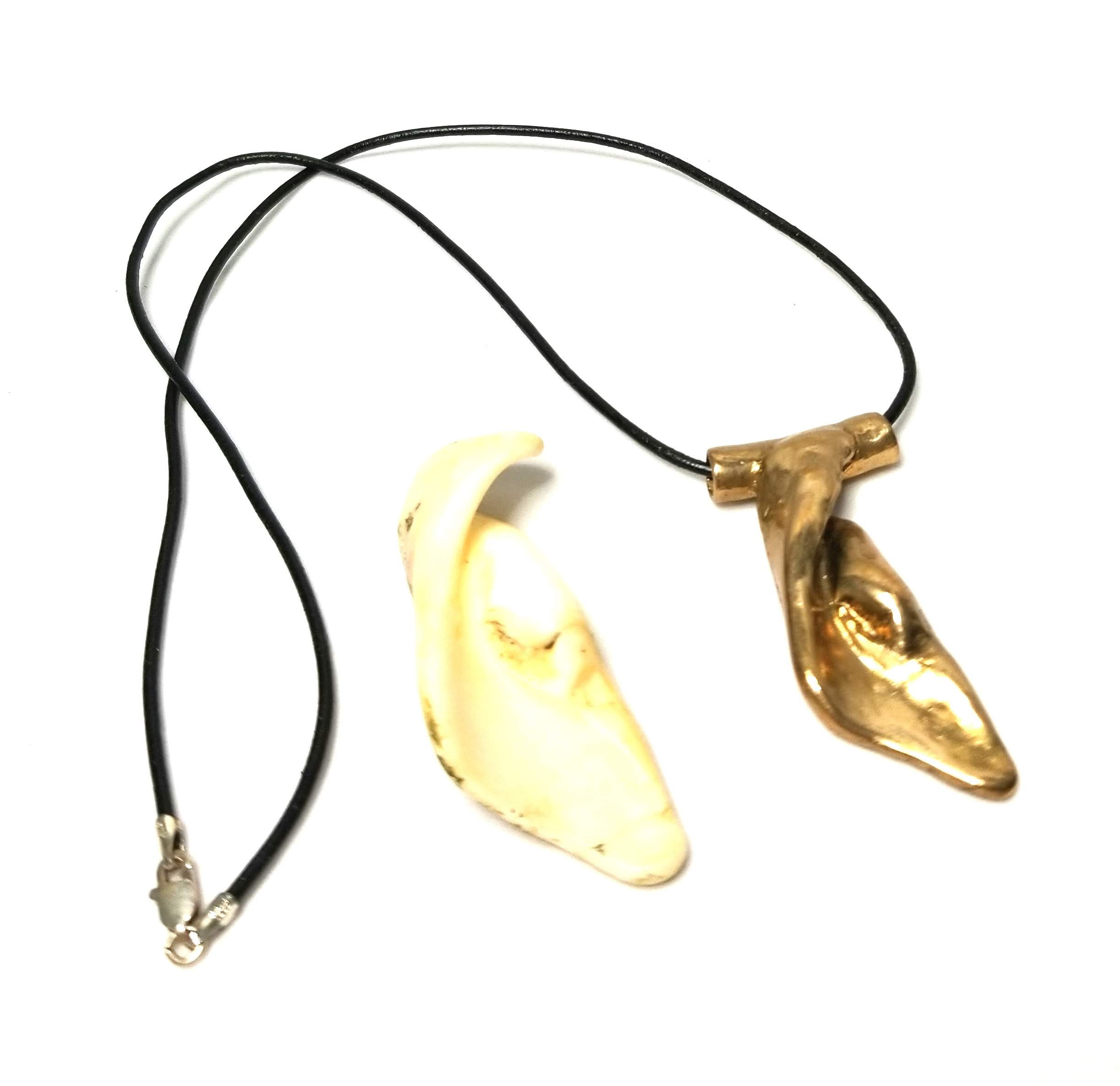 Designer by M. Milana, choker, black leather with bronze shell pendant.