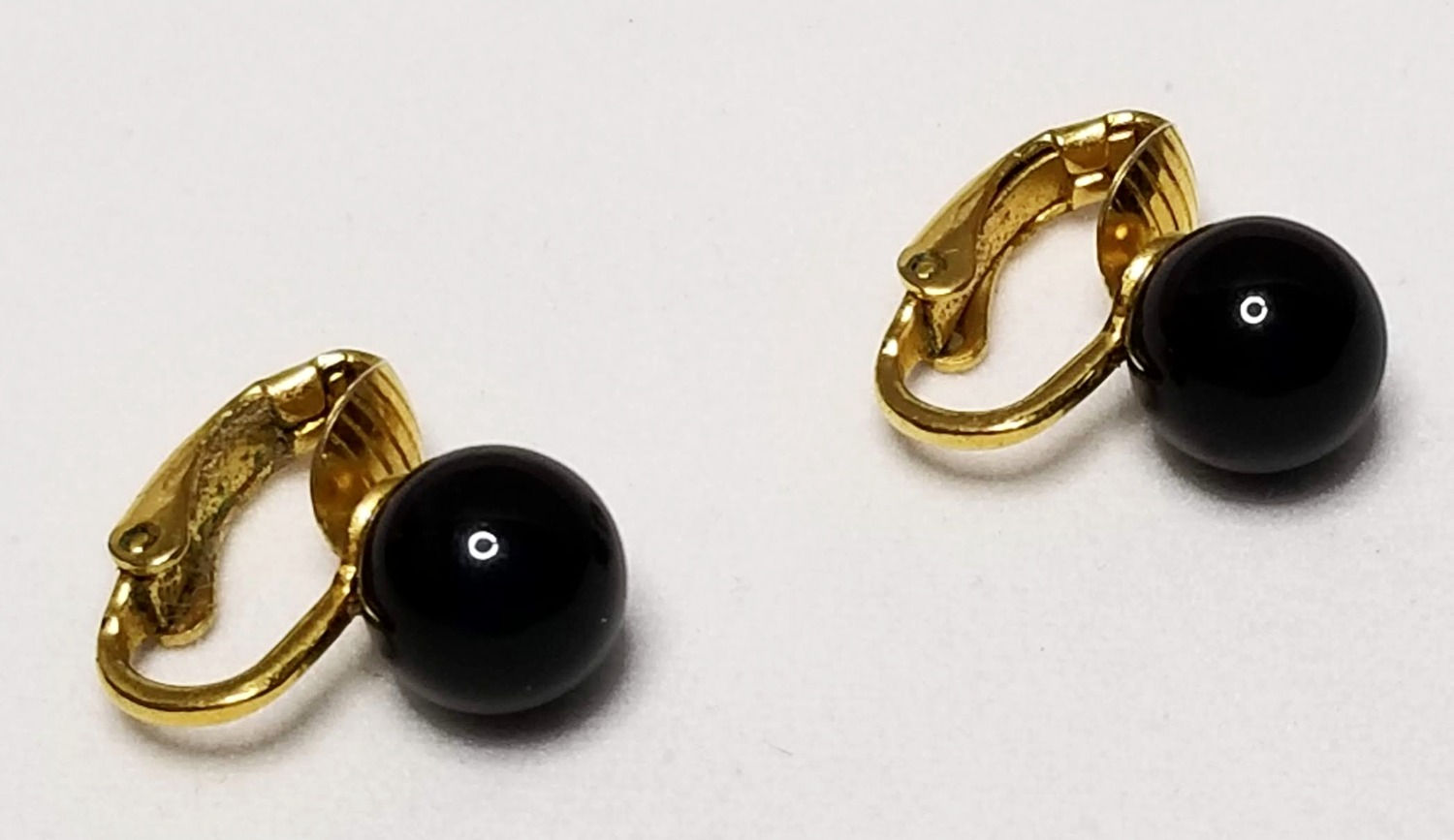 Designer by Trifari Crown, earrings, clip on black cabochons in gold tone.
