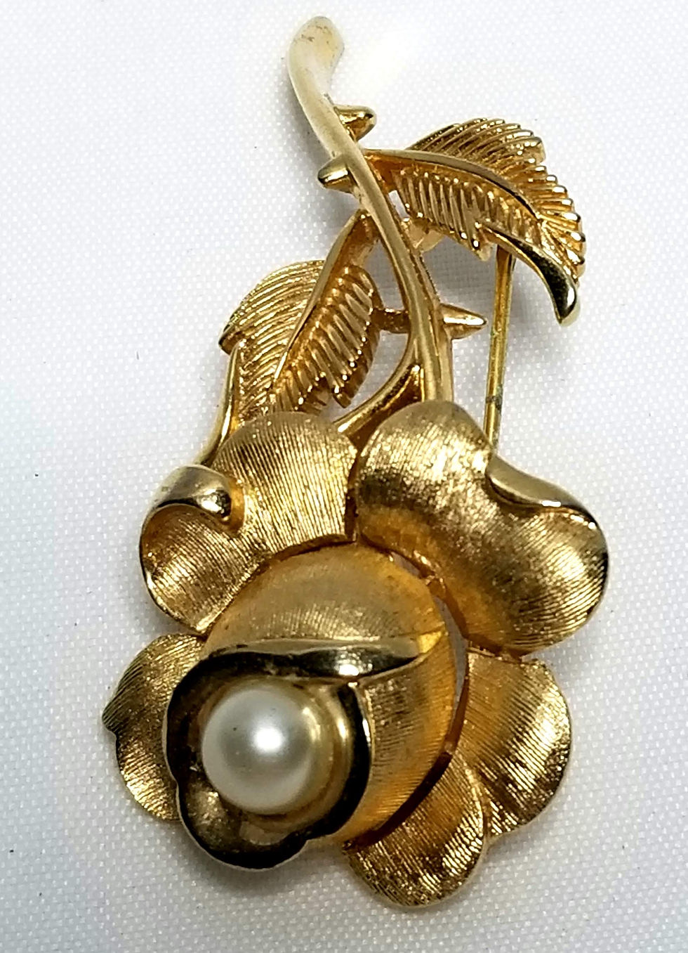 Thumbnail: Designer by Trifari, brooch, rose motif with faux pearl in gold tone.