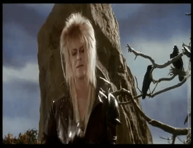 Jareth the Goblin King tossing a crystal that turns into a peach to Hoggle