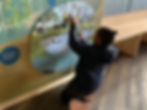 Girl playing with the game at the Wildlife Discover Centre