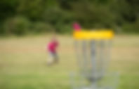 Girl Playing disc golf 