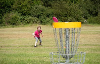 Girl Playing disc golf