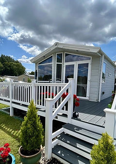 Holiday home with decking and flower pots