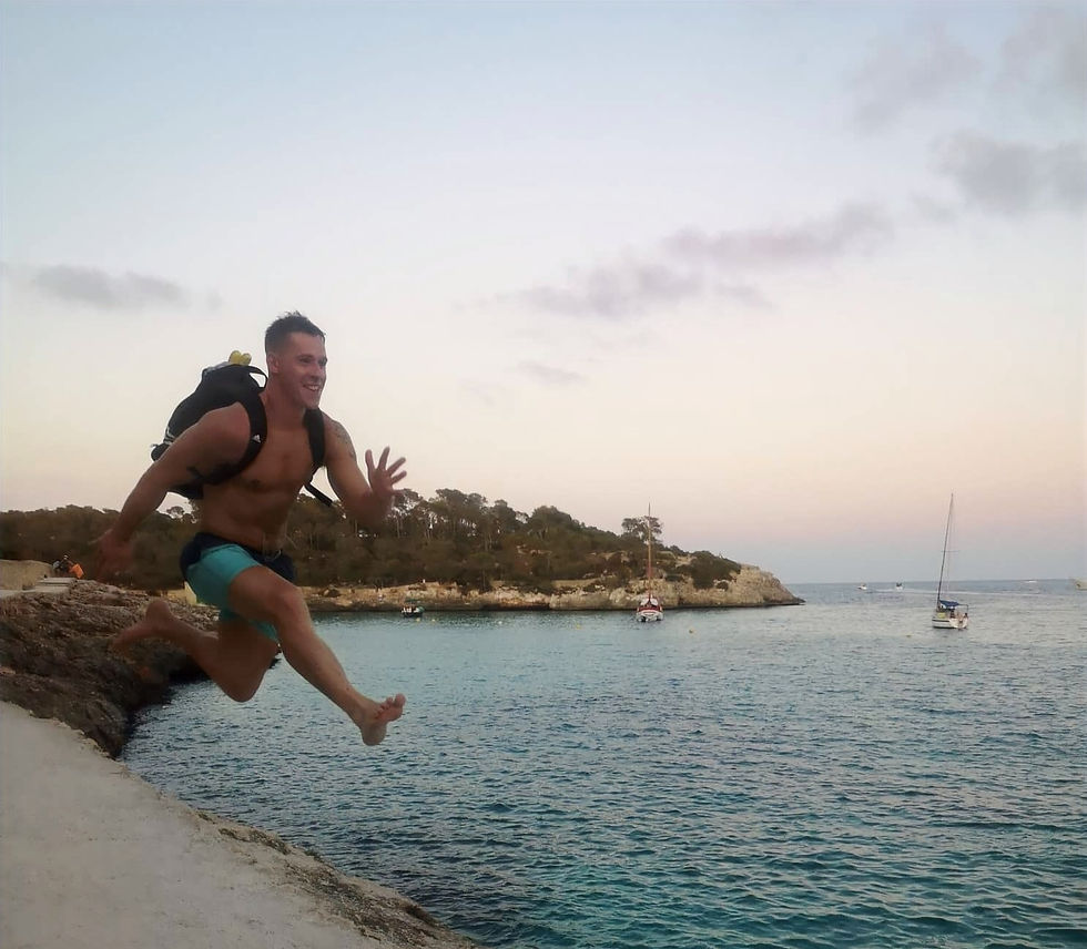 Finn Glenn Jumping on the beach in Spain. Irelands Personal Trainer Kenmare Fitness coach