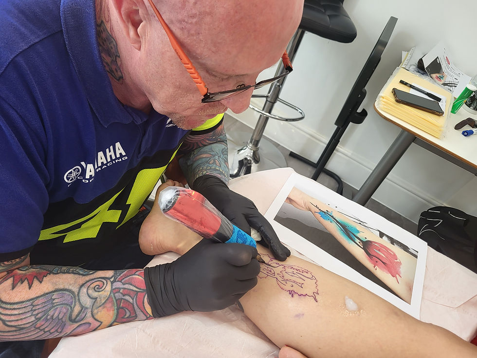 Student receiving practical tattoo training at London Tattoo Academy Espana in Alicante, Spain