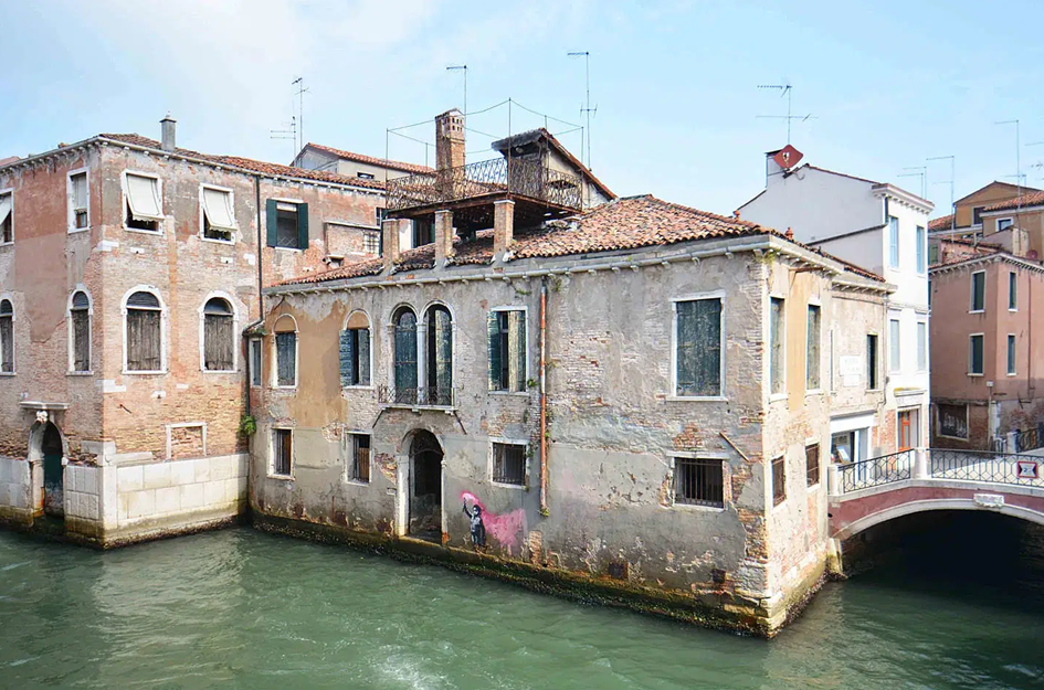 The Palazzo San Pantalon, featuring Banksy’s work, before restoration.