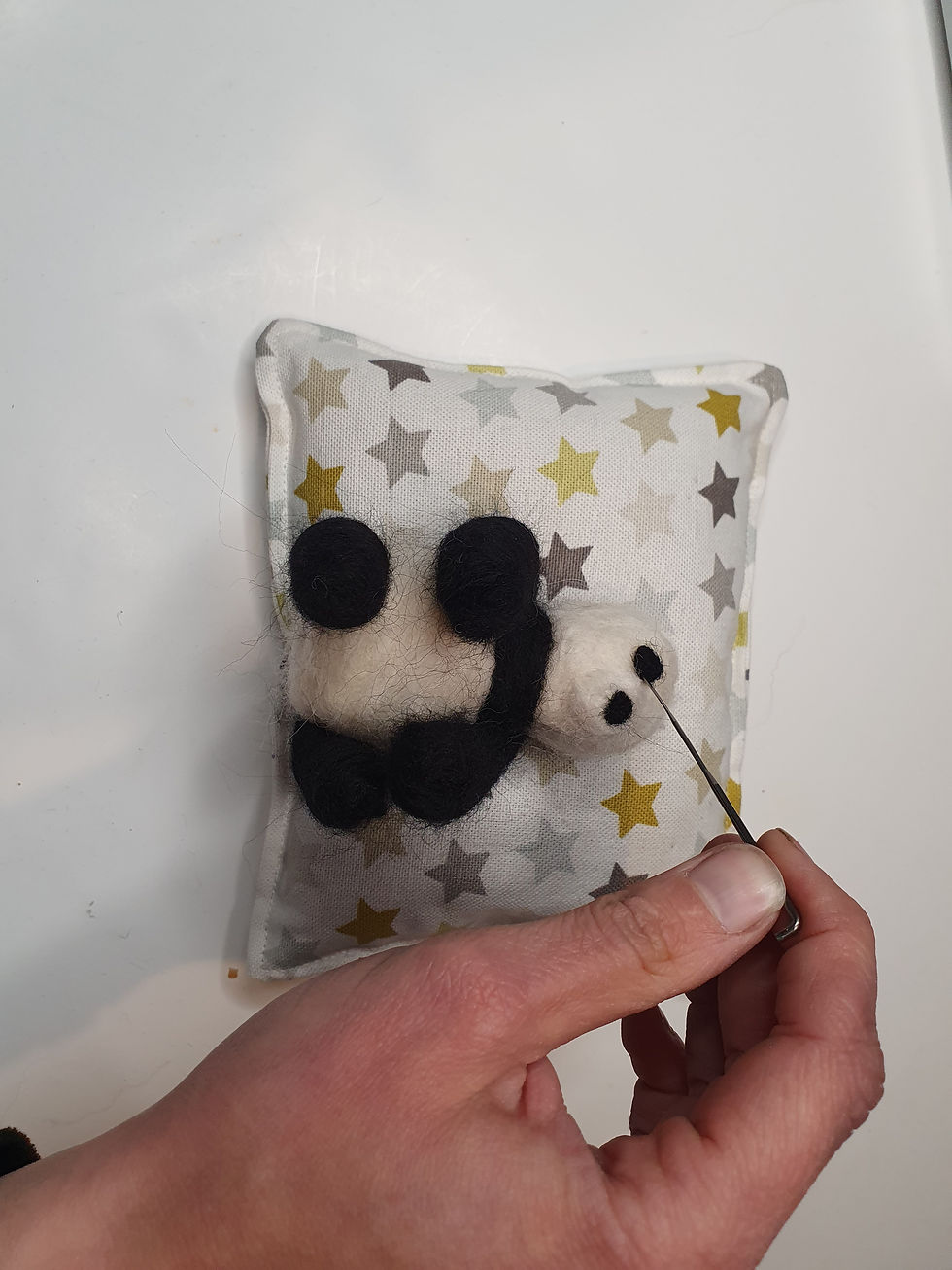Thumbnail: felting a panda