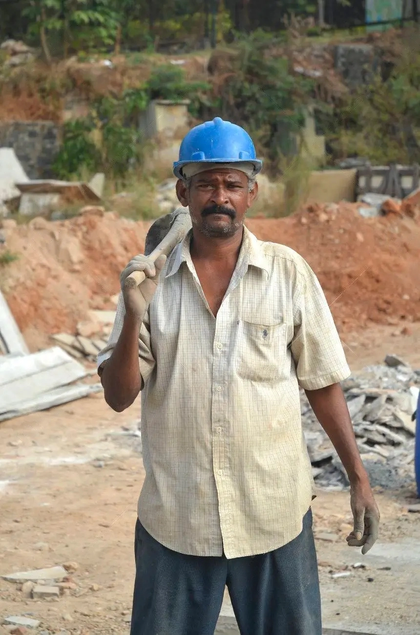 26419166-mumbai-india-january-2014-worker-mixing-cement-at-construction-site-of-global-vip