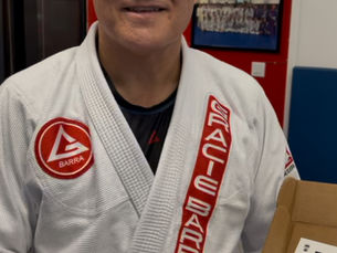 Gracie Barra Student Holding Oxylux Gift Box
