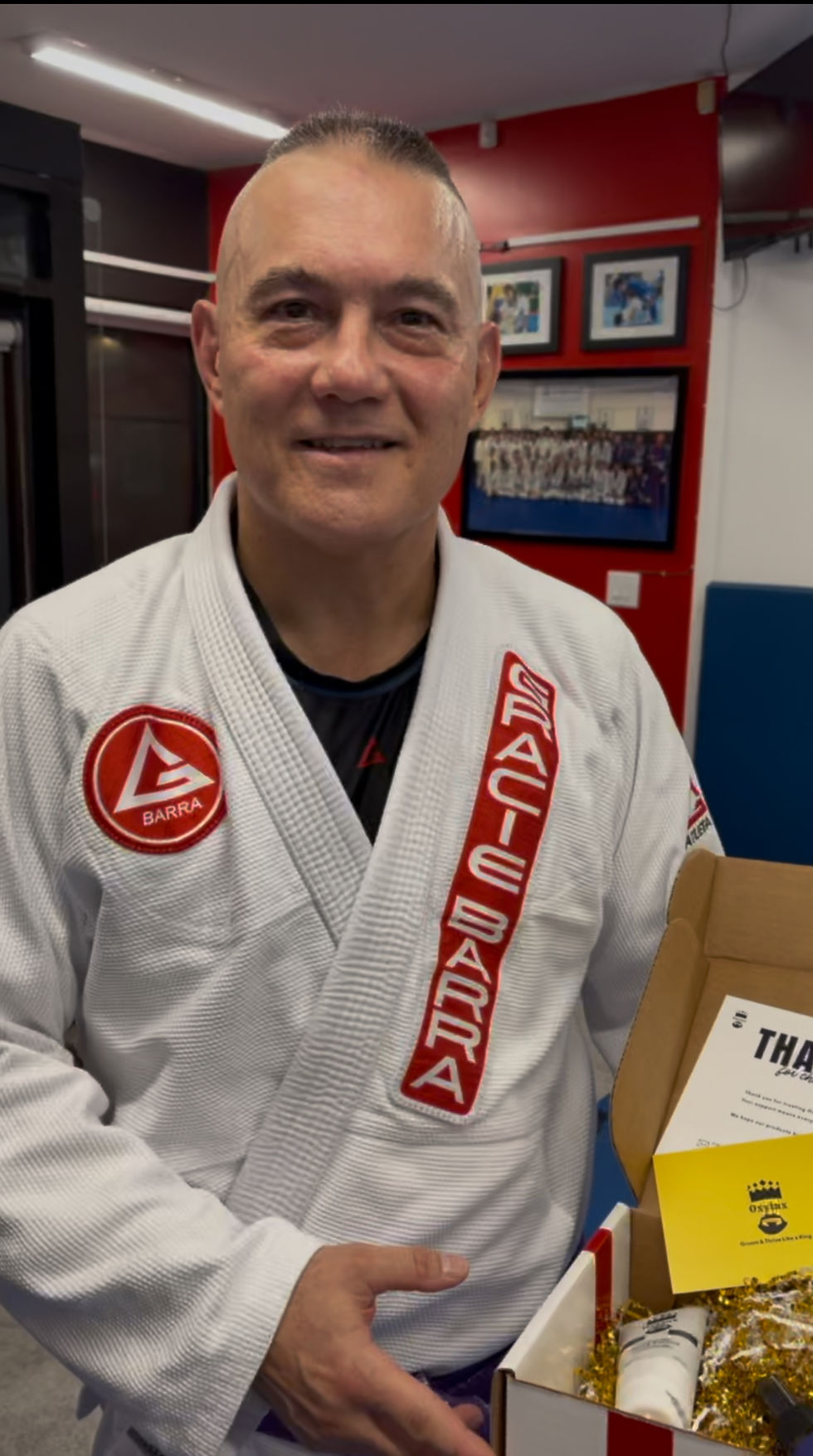 Gracie Barra Student Holding Oxylux Gift Box