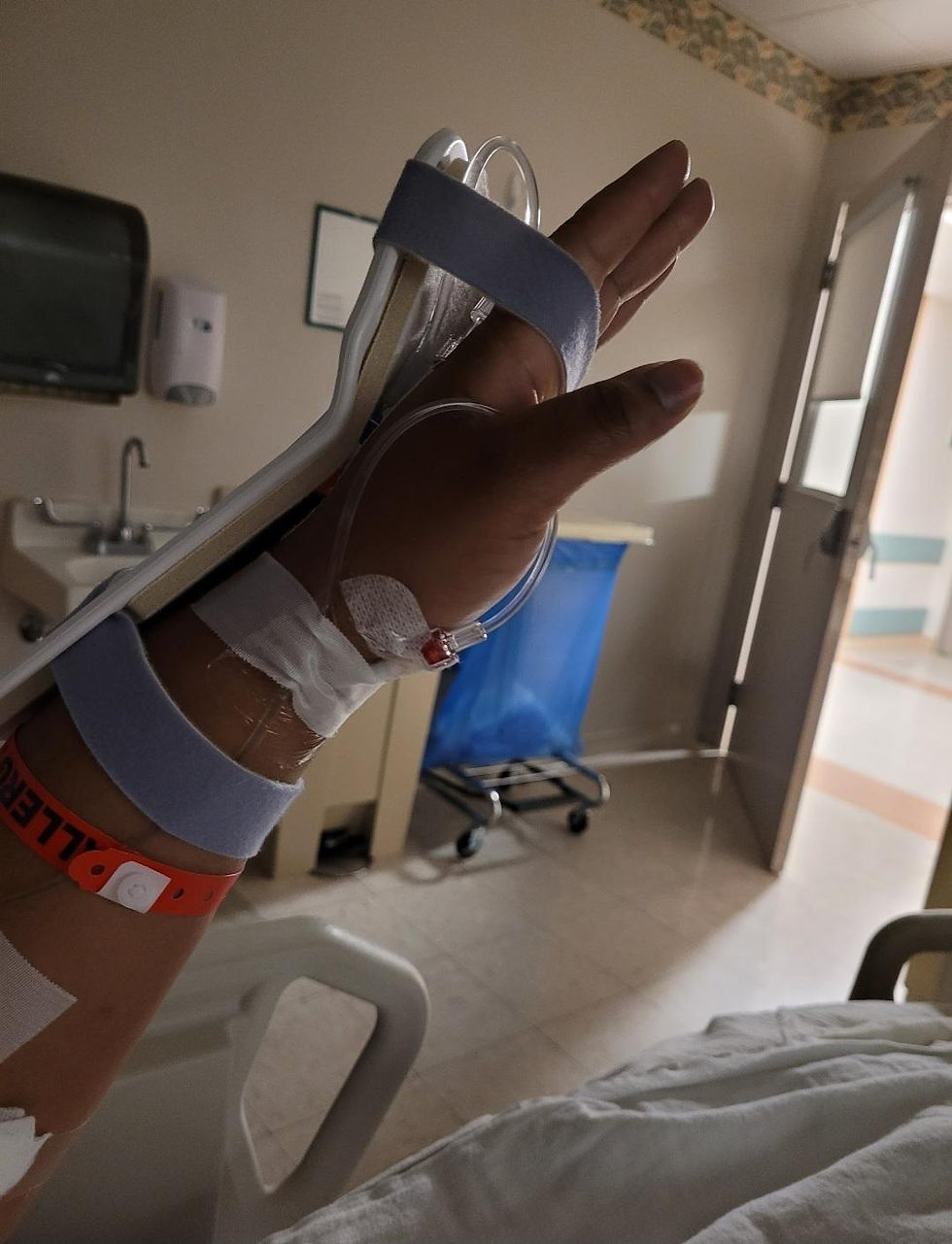Joyce Noel-Merisier raising hands to pray and worship after surgery