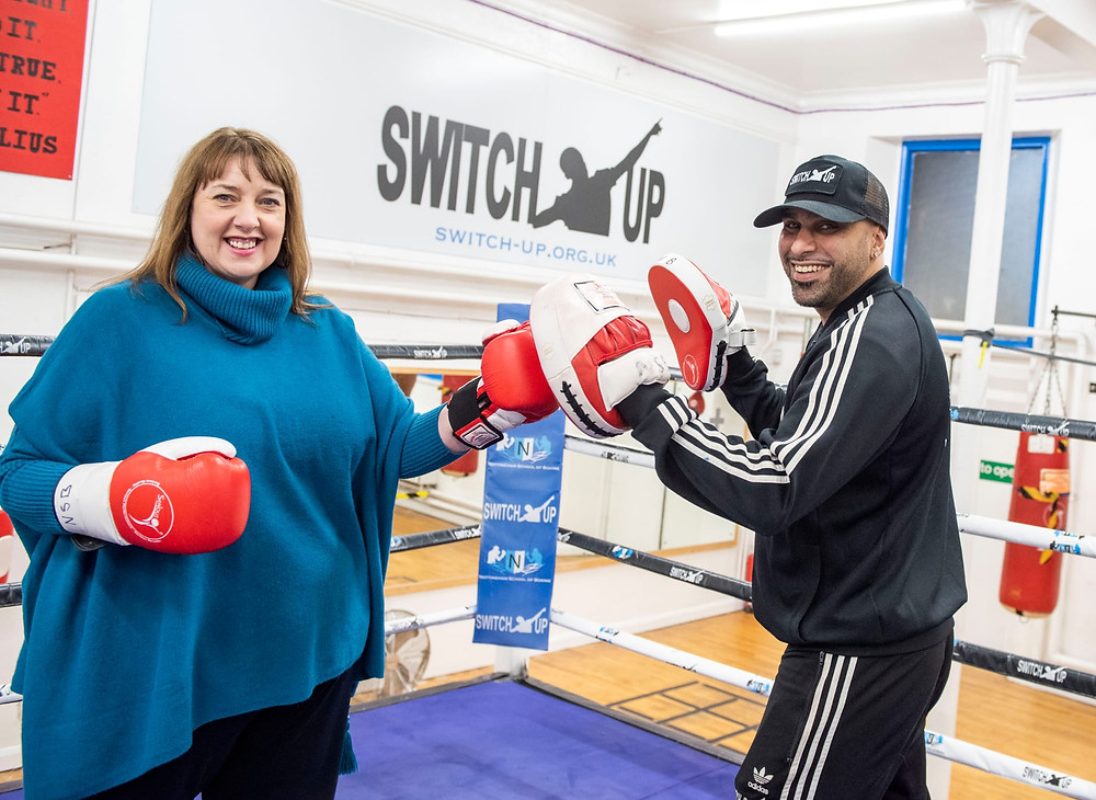 Commissioner Henry "sparring" with Marcellus Baz