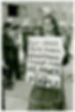 Woman holding sign at gay liberation protest