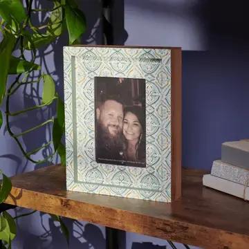 Thumbnail: Green and white tile-patterned wooden shadowbox photo frame with inset photo opening, styled on a shelf