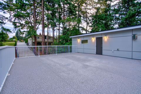 Take your outdoor living to new heights with a custom rooftop deck by NATE Construction - stunning designs, quality materials, and expert installation