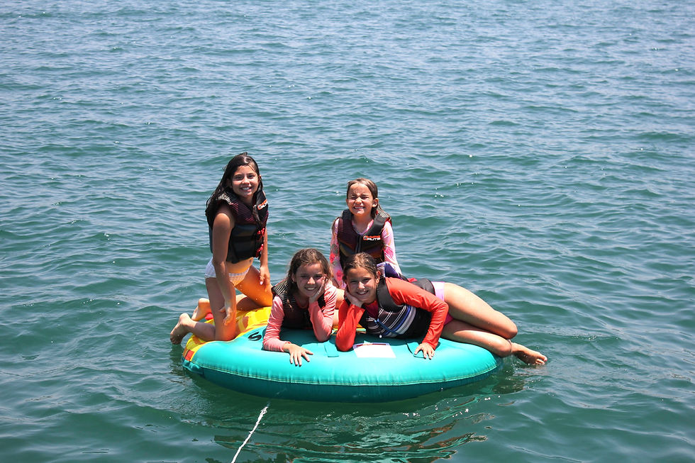 Wakeboarding, wakesurfing, swimming, beach parties, & silly games - everyone has fun in the water.
