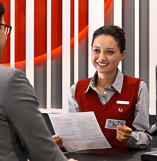 photo-man-at-post-office-counter-by-female-retail-employee.jpg.auspostimage.970_0.169.medi