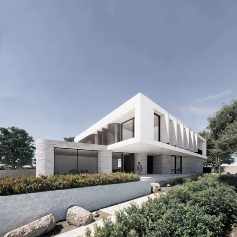 Side elevation of Casa Renown with vertical sunshades, curved brick walls, and landscaped garden, designed by Melbourne architect Enclave Architects.