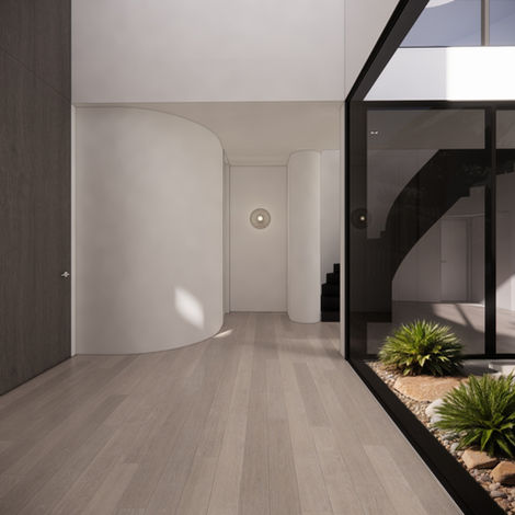 Entry sequence at Summerhill Residence, Glen Iris with curved Littlehampton brick and soft landscaping by Enclave Architects.