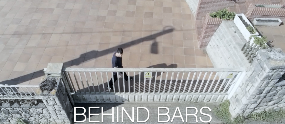 BEHIND BARS