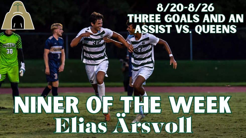 Men's soccer players celebrating after a goal