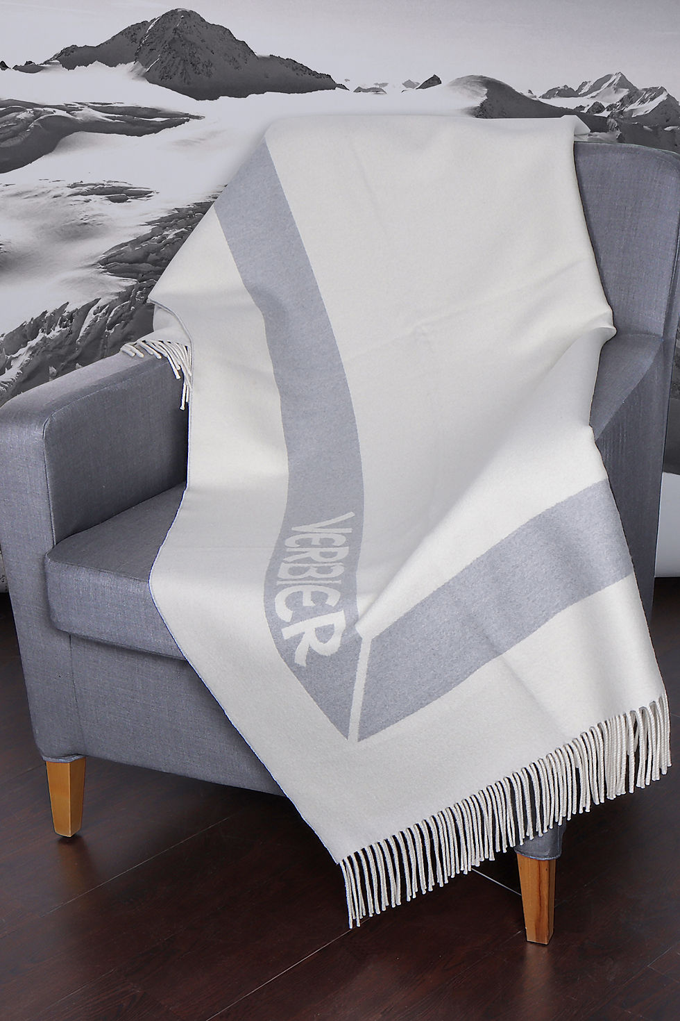 Soft winter shadows cast across a wool throw.