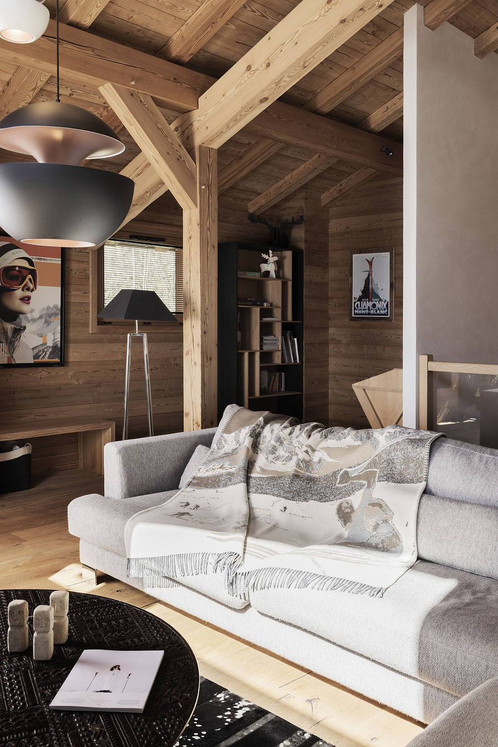 : Viñas Genève blanket draped on sofa with a table nearby