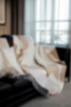 Elegant cashwool throw blanket styled in a cozy living room
