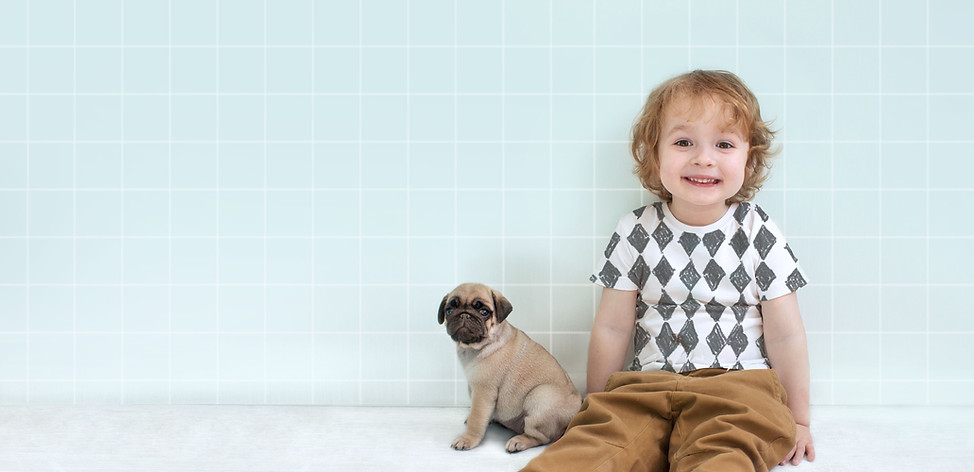 Boy with Pug Puppy