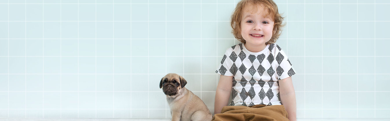 Boy with Pug Puppy