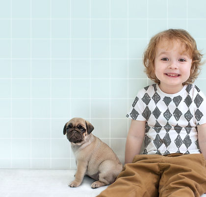 Boy with Pug Puppy