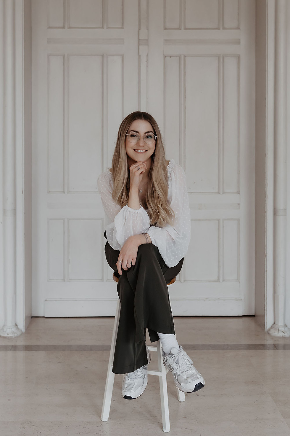 Illustrator Luisa sitting on barstool, profile photo