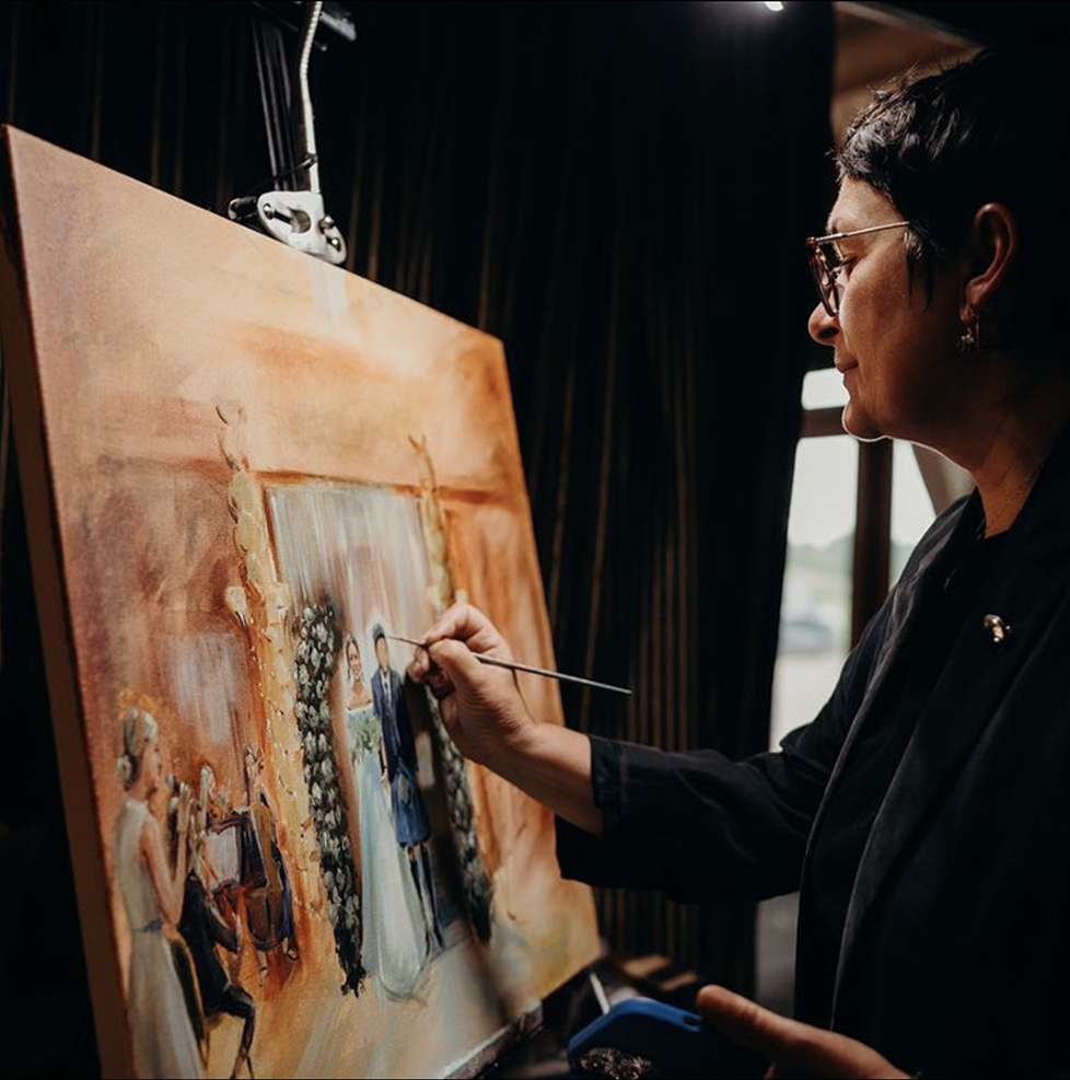 Live painter Maiia Vysotska, working with paint brush