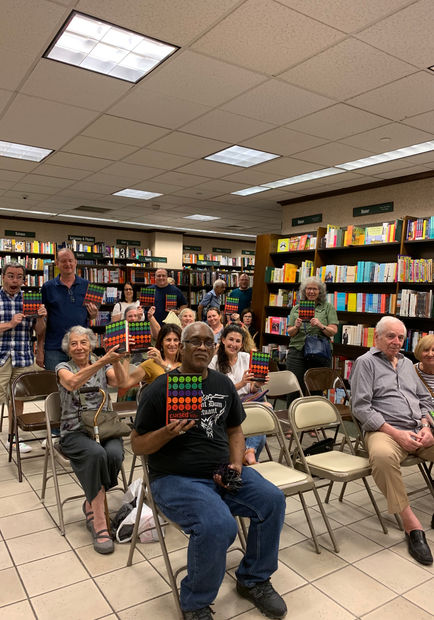 The crowd at Barnes & Noble holds of their copies of Cursed