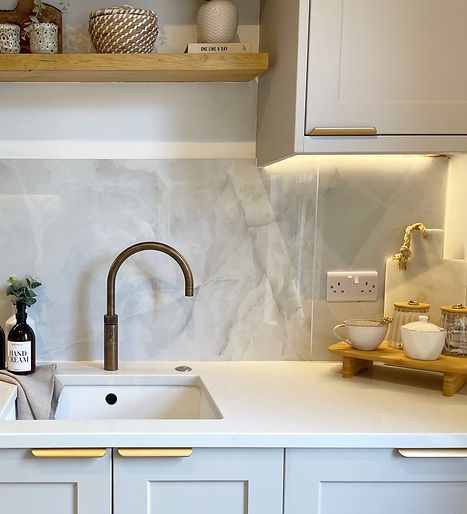 Modern grey kitchen with gold handles installed by SB Carpentry and Building – Expert kitchen fitting services in Bournemouth