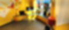 Shop fitting for a bubble tea shop in Bournemouth town center, featuring custom seating and vibrant brand colors of yellow and red, expertly designed by SB Carpentry & Building