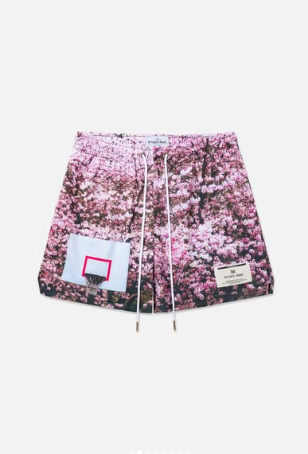 Close-up of Court Vision shorts, featuring archival photography print by Interlude Collective.