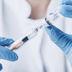 clinician preparing an injection