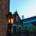 A historic cast iron gas lamp sits in vigil over the columbarium